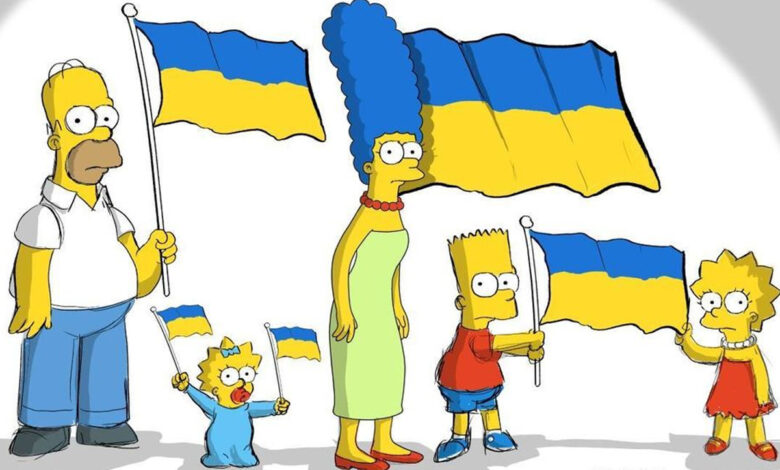 arge, Homer, Bart, Lisa et Maggie arborant chacun un drapeau bleu et jaune