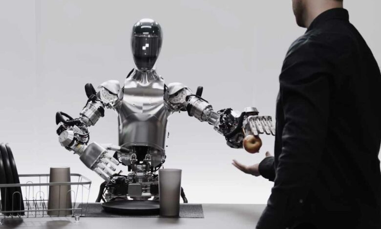 Le robot Figure 01 donnant une pomme à son interlocuteur.