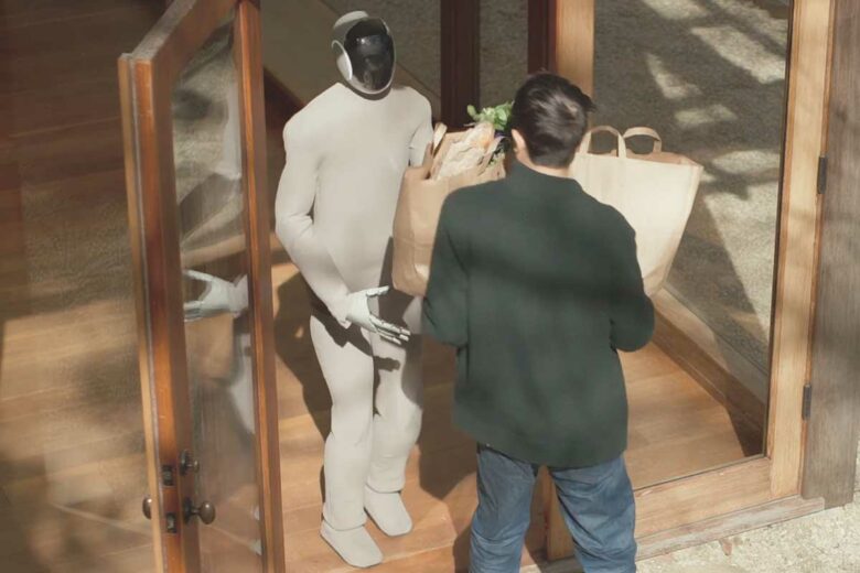 Un robot assiste un humain pour porter des courses.