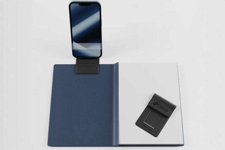 Un support en cuir végan pour lier un téléphone et un cahier.