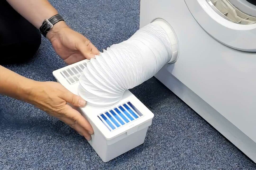 Installation d'un kit condenseur pour sèche-linge.