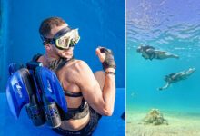 Un nageur équipé du jetpack Shark de KikFin.